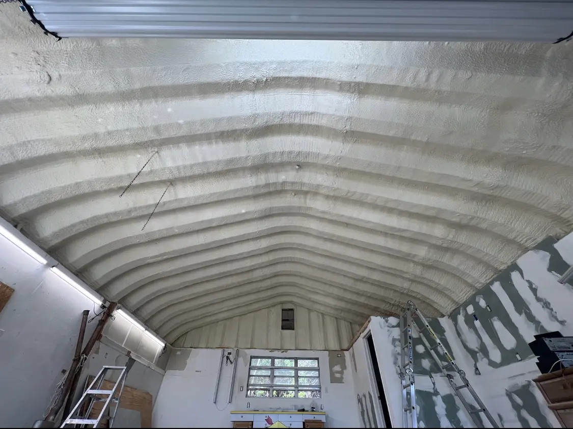 Spray polyurethane foam applied to the underside of a metal roof deck in Amherst