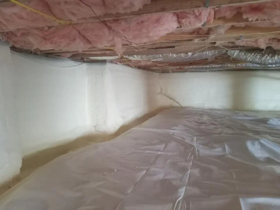 Crawl space encapsulation with closed-cell spray foam for Commercial Roof Restoration in Amherst